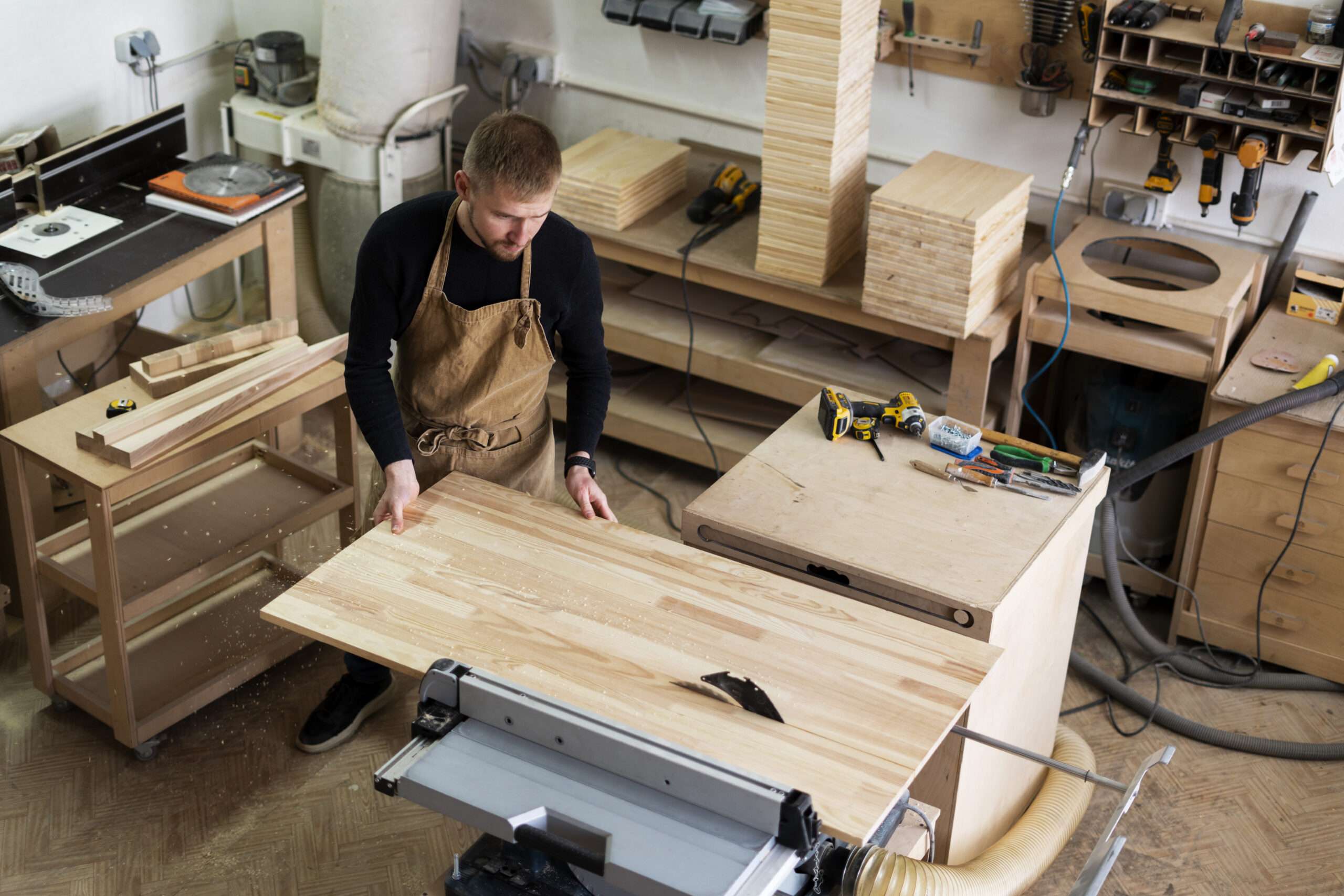 Home man working wood engraving workshop